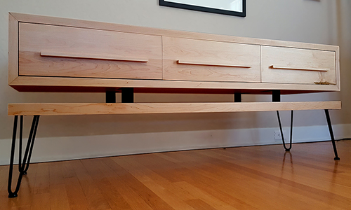 Mid century console table with three drawers and classic hairpin legs